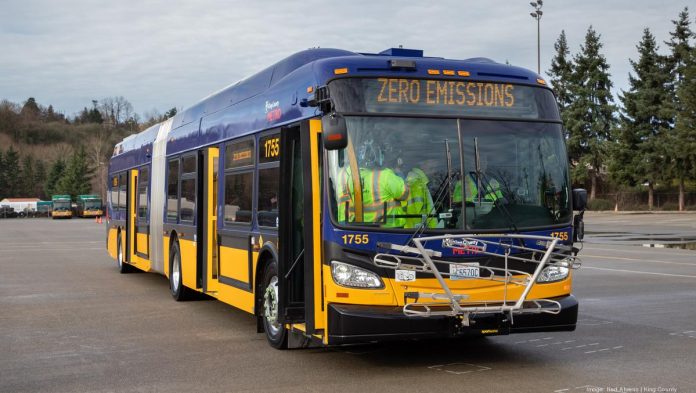 A battery-powered bus during a press event.