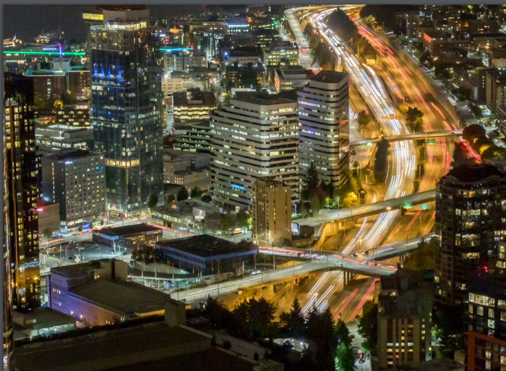 A time-lapse night shot of I-5 facing north showing all the taillights bleeding together.