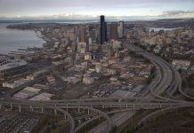 Senate Compromise Torches Most Progressive Elements of Biden Infrastructure Plan A birds eye view of Downtown Seattle from the south with the I-5 and I-90 spaghetti interchange dominating the frame.