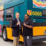 Gannon, White, and Pride Bus by Ned Ahrens