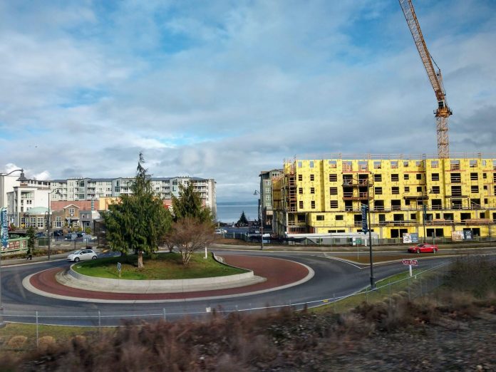 A large construction project near a roundabout in Tacoma.