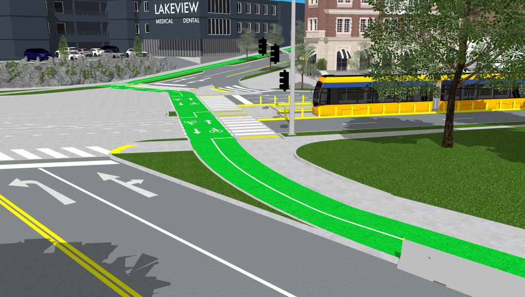 Streetcar at an intersection with a green bike lane.