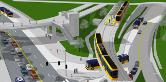 The Husky Stadium pedestrian bridge rendered with an elevated tram line next to it.