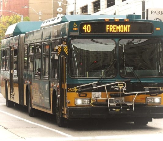 Mayor Durkan Proposes $23.7 Million in Transit Investments with I-976 Defeated A green and yellow Route 40 with Fremont displayed on its screen with downtown towers in background.