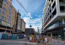 Seattle Inches Down Path to Design Review Overhaul with New Report Seven-story midrise apartments along a pedestrian plaza.