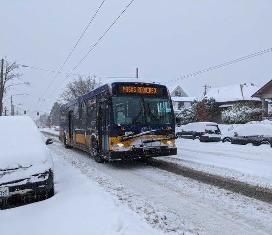 Transit Agencies Waive Fares on New Years Eve A Metro bus operating on a snowy Beacon Hill. (Owen Pickford)