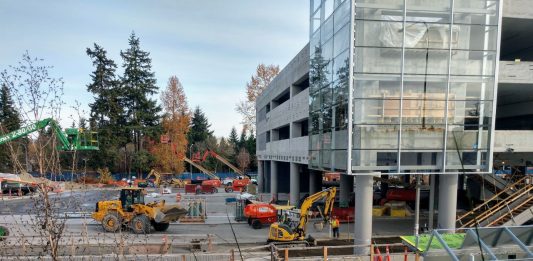 Construction workers and heavy equipment at the light rail station near Microsoft's Redmond headquarters.