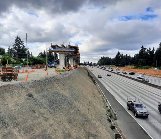 Draft Plan Inches Toward Modest Upzones around 130th and 148th Street Link Stations A light rail guideway rises on the edge of the I-5 freeway trench at the 130th Street overpass in Seattle.