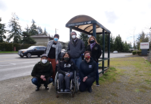 BIPOC and Disability Advocates Zero In on Highway Spending A woman in a wheelchair and five other advocates at a Tacoma bus stop.