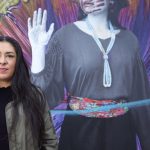 Colleen Echohawk campiagn photo with mural