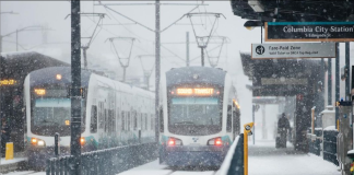 Two Link trains at Columbia City Station in the February snow.