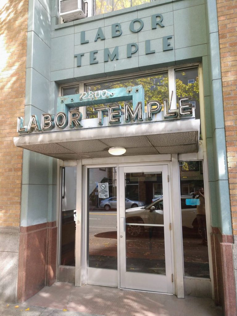 The main entrance to the Seattle Labor Temple includes Art Deco awning and detailing.