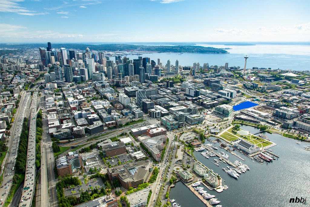 The skyline of Seattle from the north with South Lake Union in the foreground.