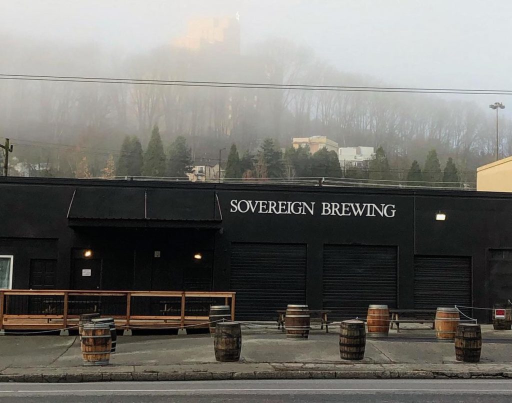 Sovereign Brewing use barrels with ropes to cordon off a patio space.