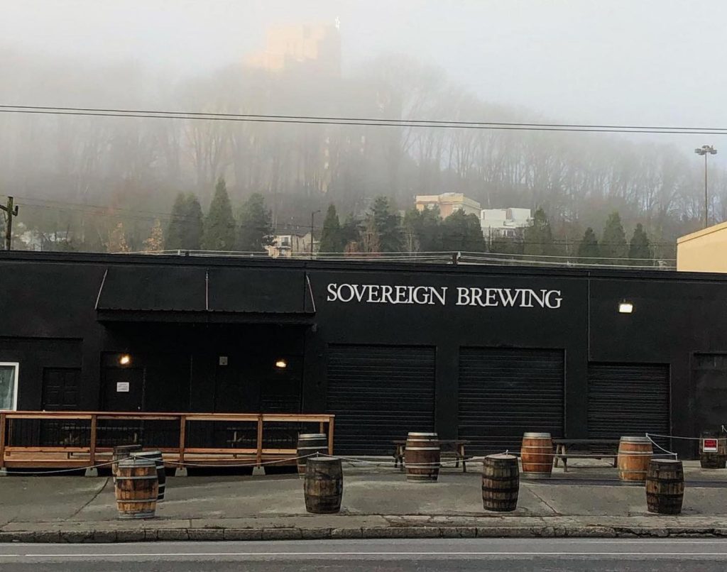 Sovereign Brewing use barrels with ropes to cordon off a patio space.