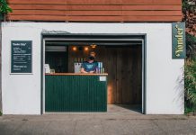 Garage Businesses Are Keys to Covid Recovery Yonder Cider's street-side garage bar in Greenwood. (Yonder Cider)