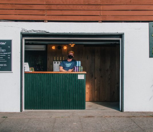 Garage Businesses Are Keys to Covid Recovery Yonder Cider's street-side garage bar in Greenwood. (Yonder Cider)
