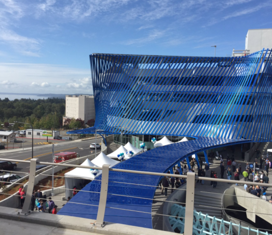 Sound Transit Charts an Expanded Paid Parking Program A four-story parking structure with a blue decorative screen.