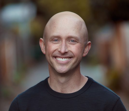 Urbanist Supervolunteer Ron Davis Jumps In D4 Council Race to Replace Alex Pedersen Image description: Ron is a bald White man wearing a black shirt and a smile.