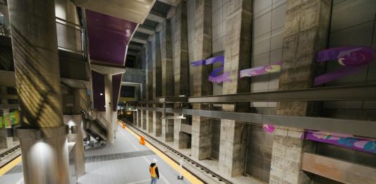 A construction stands on the underground station platform at Roosevelt Station.