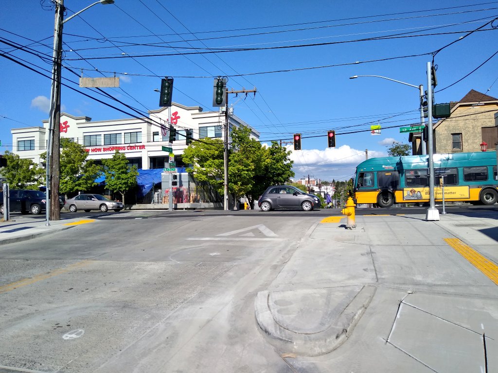 Curb extensions at S King St and 12th Ave S are intended to bring the bike lane onto the sidewalk on either side of the intersection. (Photo by the author)