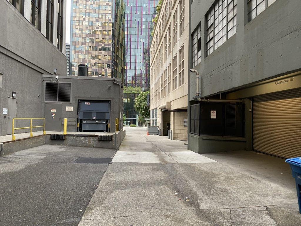 Who wants to hang out here next to exhaust pipes, trash, and no active use? This space could be something wonderful, just a half block from a major office campus. (Image by the author)