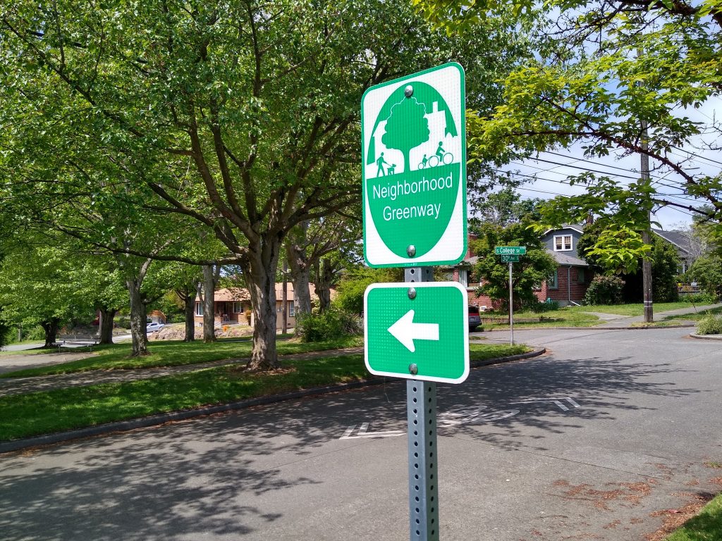 Current neighborhood greenway signage directs users to turn onto S College St, where the wayfinding immediately disappears. (Photo by the author)