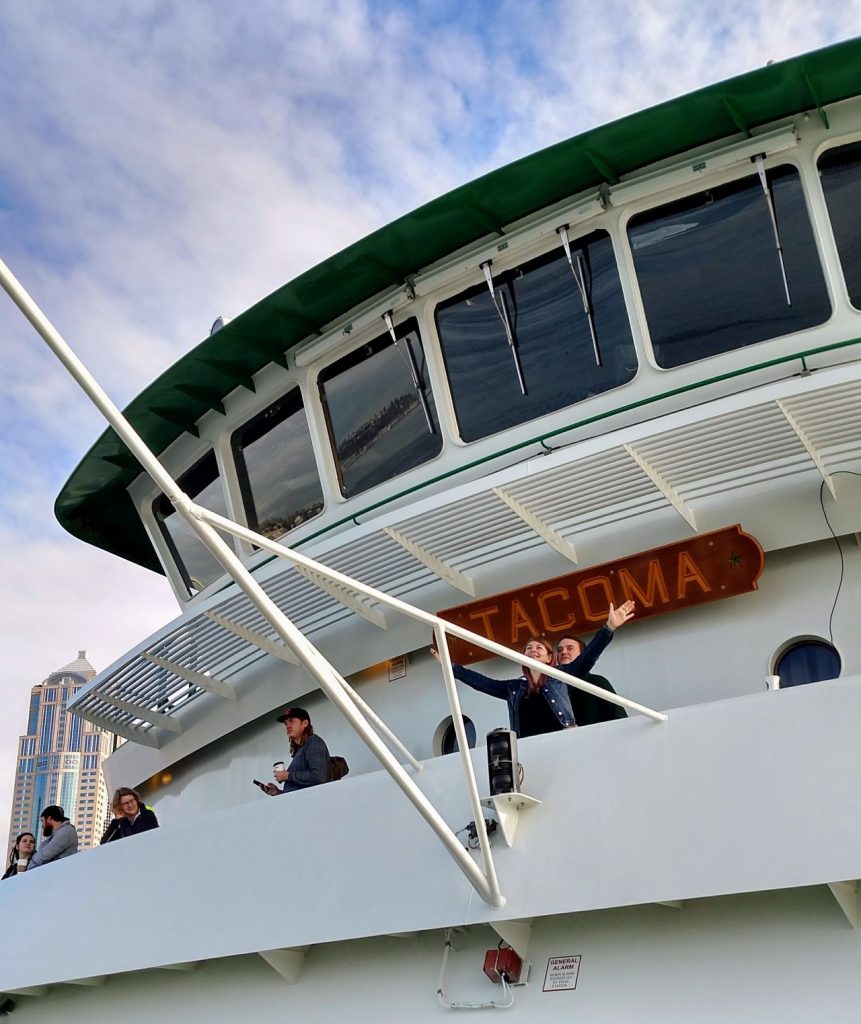 Person on a ferry boat as seen from a lower deck