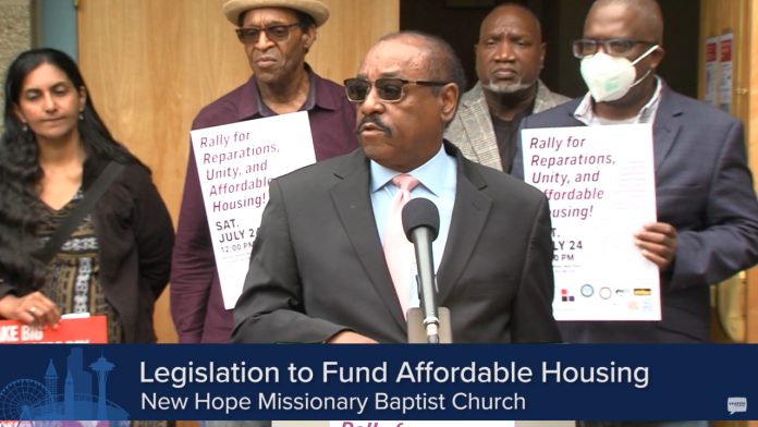 Sawant press conference on reparations Senior Paster Robert Jeffrey Sr. stands with Councilmember Sawant and three supporters in the background at a press conference calling for reparations for New Hope church.
