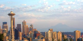 A photograph showing the skyline Downtown Seattle's tall buildings at sunset as viewed from Kerry Park in Queen Anne.