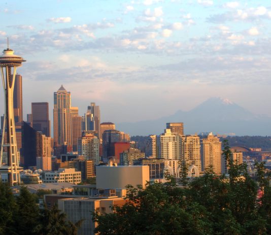 Building on The Urbanist’s Vision A photograph showing the skyline Downtown Seattle's tall buildings at sunset as viewed from Kerry Park in Queen Anne.