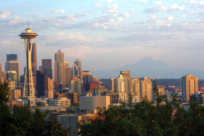 A photograph showing the skyline Downtown Seattle's tall buildings at sunset as viewed from Kerry Park in Queen Anne.