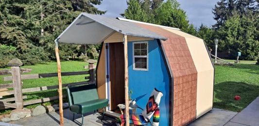 A view of a tiny house creation with a front porch from LiteHouse Shelters.
