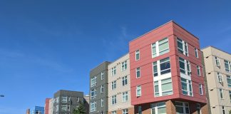 A five-story apartment building in Issaquah at 1118 7th Ave NW/1036 7th Ave NW/600 NW Locust St.