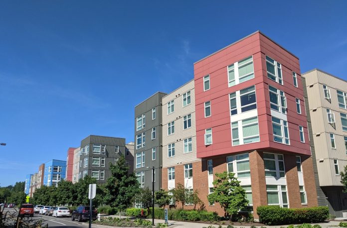 A five-story apartment building in Issaquah at 1118 7th Ave NW/1036 7th Ave NW/600 NW Locust St.