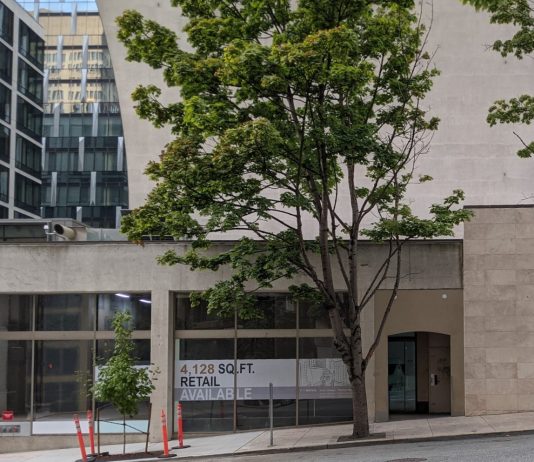 Seattle to Boost Downtown with Additional Street-Level Uses A sign says 4,128 square feet of retail are available.