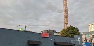Serious Pie and Biscuit is shuttered. Construction cranes tower in the background.