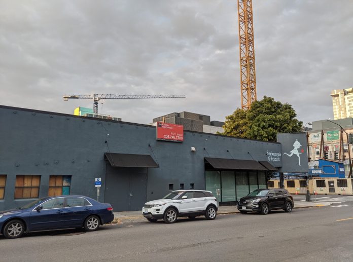 Serious Pie and Biscuit is shuttered. Construction cranes tower in the background.