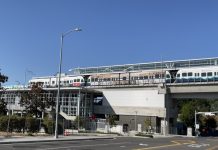 A Transit Rider’s Guide to the Northgate Link Light Rail Extension A photo of an elevated Link light rail line over a street.