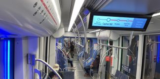 A photo of the interior of the light rail car showing the seating area.