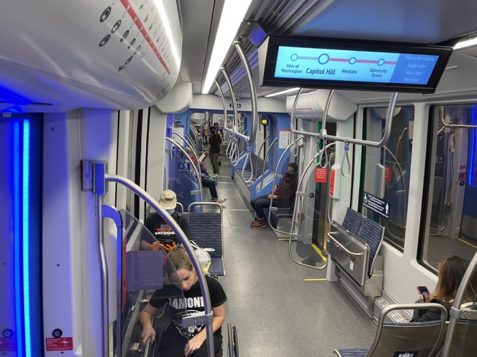 A photo of the interior of the light rail car showing the seating area.
