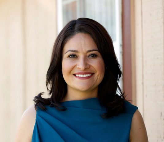 The Urbanist’s 2021 General Endorsements Lorena González wears a blue dress and has long brown hair.