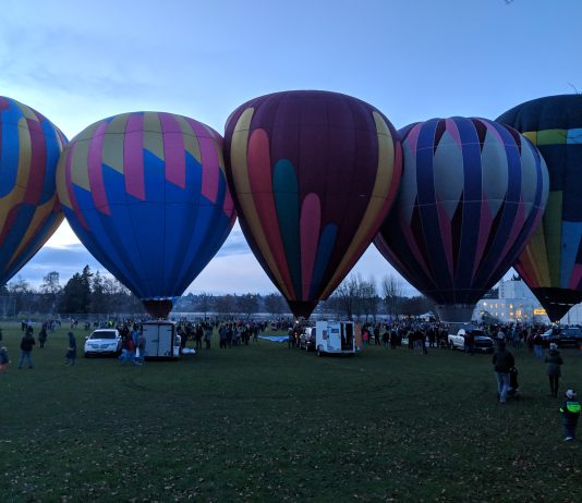 An Urbanist’s Destination Guide to the Roosevelt Station Area Five hot air balloons at Green Lake Park's eastern fields. This was taken during 2018 annual Pathway of Lights.