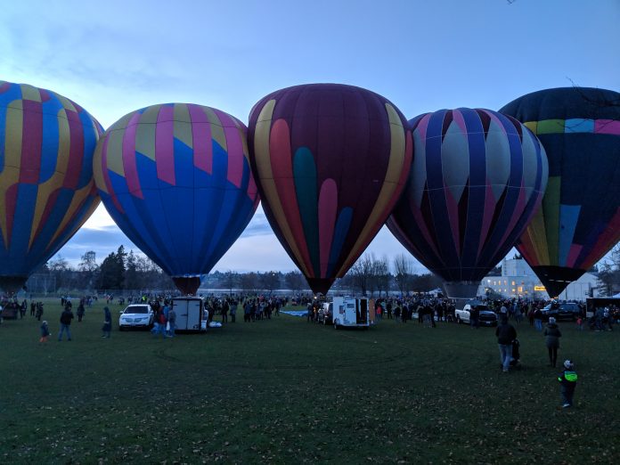 Five hot air balloons at Green Lake Park's eastern fields. This was taken during 2018 annual Pathway of Lights.