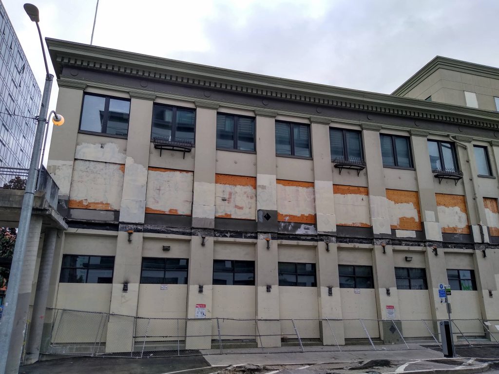 Photo of scarred building where bridge used to be attached