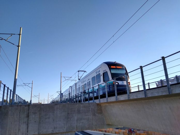 A photo of a light rail train on an elevated rail line.