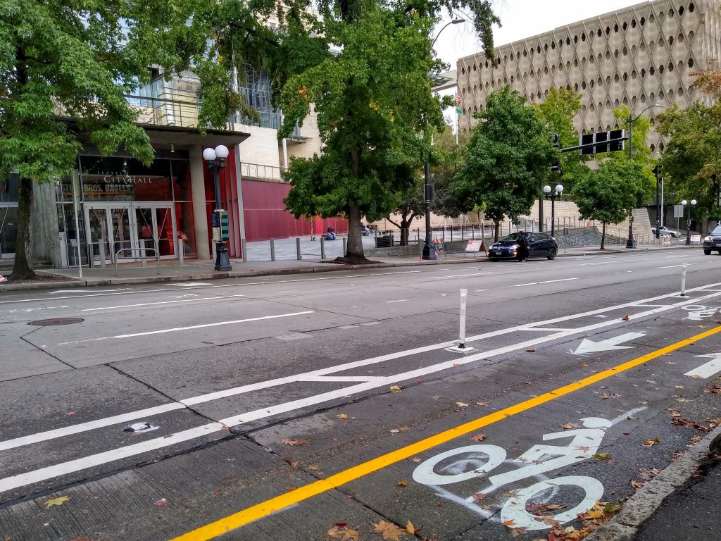 Two way bike lane in front of Seattle City Hall with plastic posts