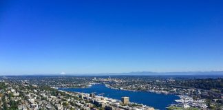 A photo showing an aerial view of Seattle looking north from the Space needle, housing, roads, and Greenlake are all visible.