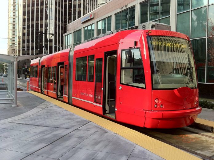A photo of a bright red streetcar.