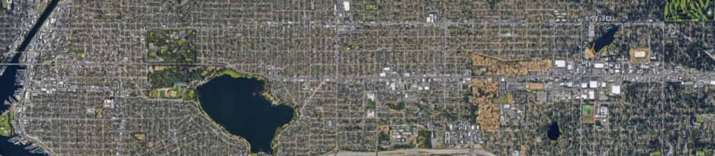 A satellite image shows SR-99 bisecting North Seattle.